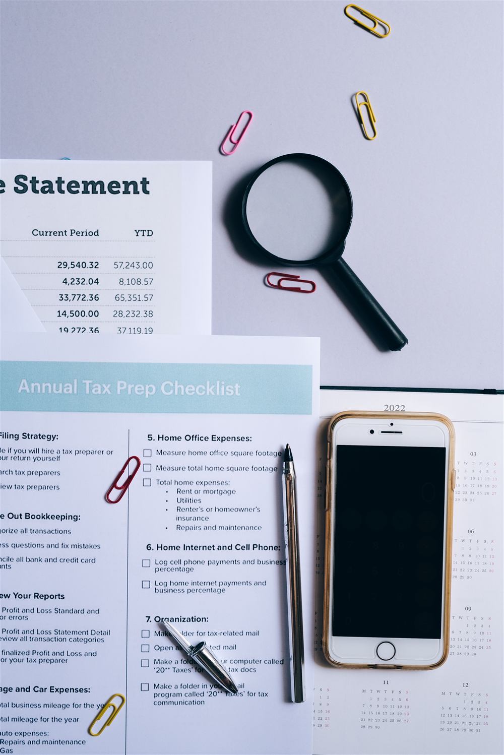 Annual tax prep checklist and financial statement under review